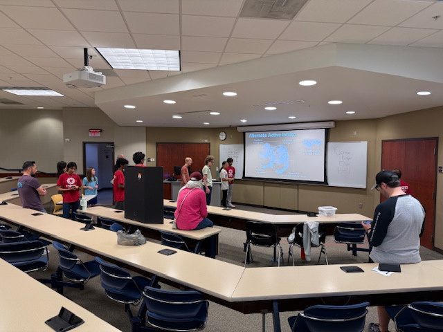Students and families at the UNCC STEM Expo presentation room